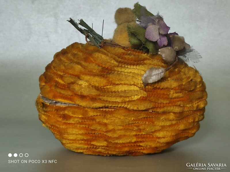 Old paper egg candy holder covered with chenille