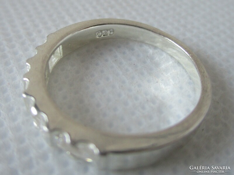 Beautiful silver wedding ring with special white zirconia stones