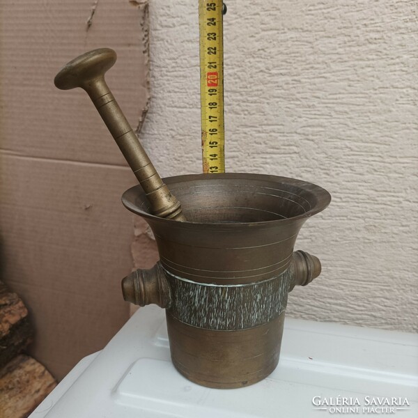 Sold with a copper mortar and pestle.