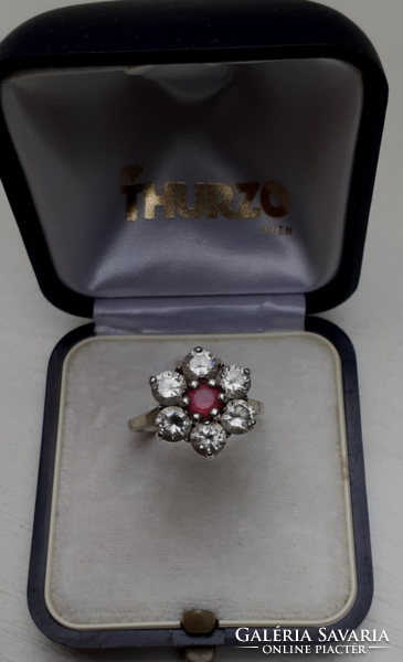 Marked silver ring with white polished set white stones in the center with a pink stone