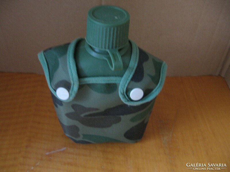 Plastic water bottle in a terrain pattern cover