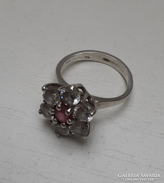 Marked silver ring with white polished set white stones in the center with a pink stone