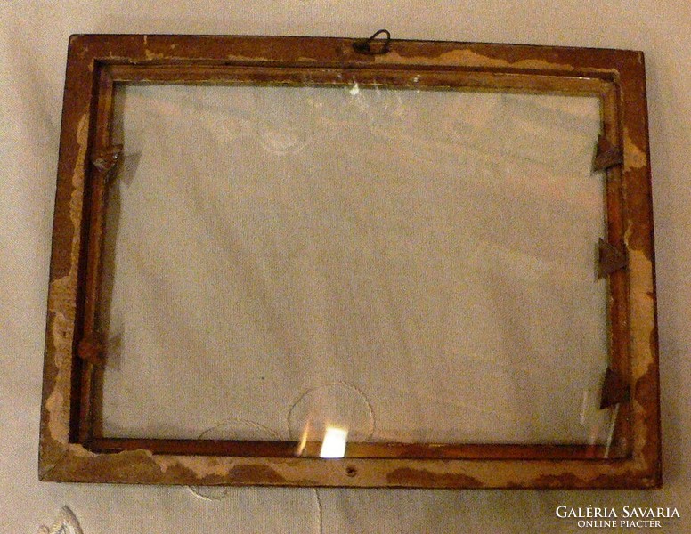 Carved wooden picture frame with glass