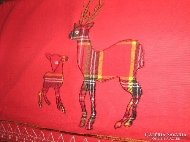 A pair of charming Christmas reindeer decorative cushion covers and table centerpieces