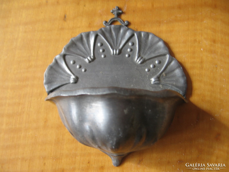 Old metal holy water container