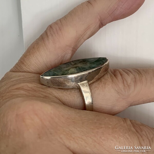Silver ring with emerald stones