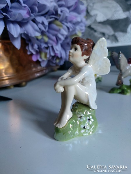 Sweet forest fairy, angel, pixie, sitting in nature and watching, detailed rare figure