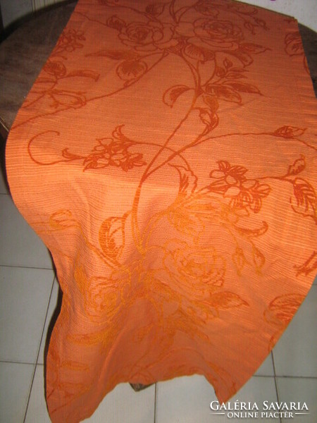 Beautiful runner in vintage red rose on orange velvet tablecloth