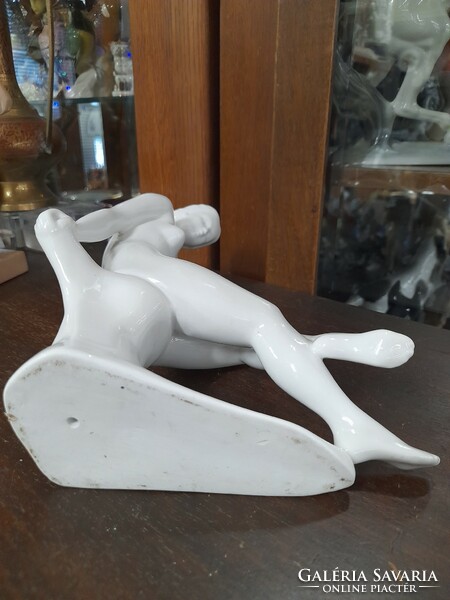 Sitting female nude figural porcelain statue. Marked. 22 Cm.