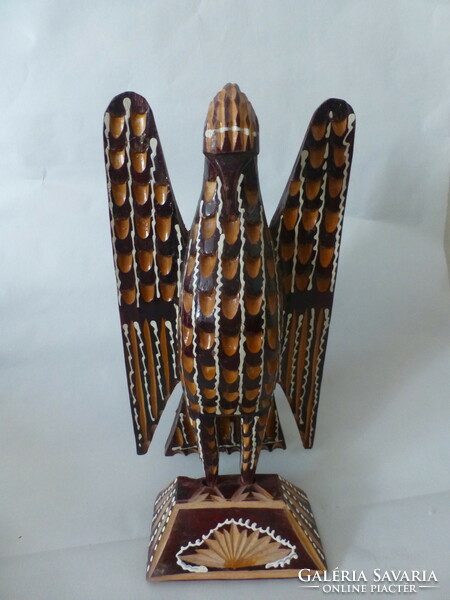 Carved wooden turul bird statue