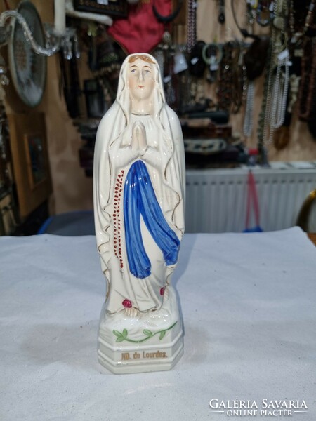 Old Virgin Mary figure.