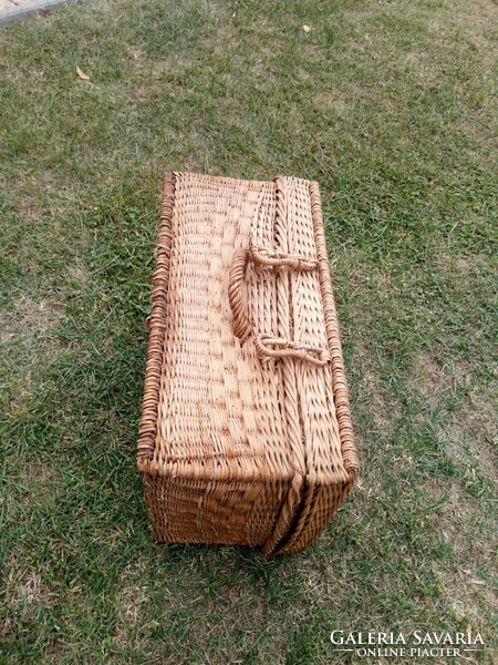 A wicker suitcase in patina from the 50s