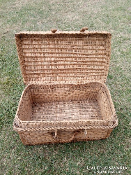 A wicker suitcase in patina from the 50s