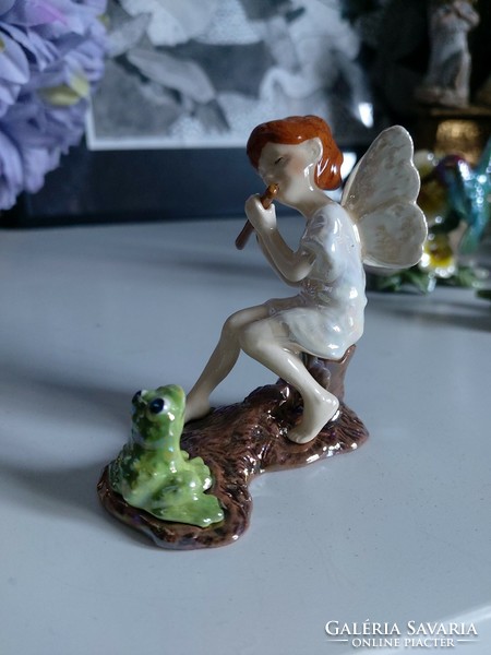 Sweet forest fairy, angel, pixie, playing flute for a frog, detailed figure