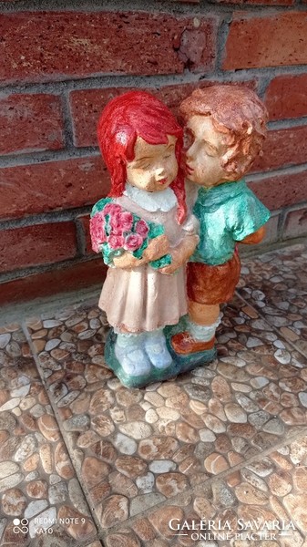 A couple in love, a little girl and a little boy couple, artificial stone statue