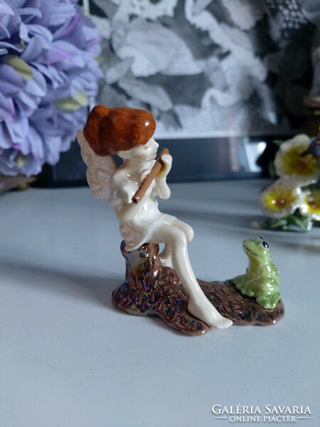 Sweet forest fairy, angel, pixie, playing flute for a frog, detailed figure