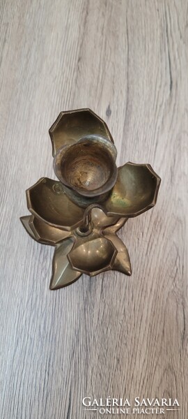 Copper floral candle holder.