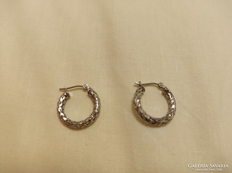 Silver hoop earrings with a beautiful engraved pattern