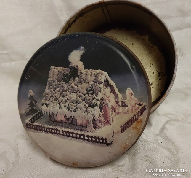 Vintage, old metal tin with gingerbread house, sugar and biscuits