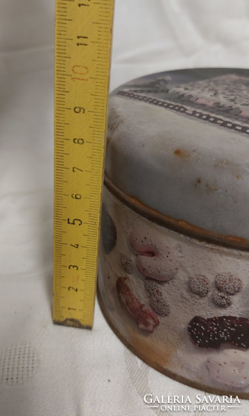 Vintage, old metal tin with gingerbread house, sugar and biscuits