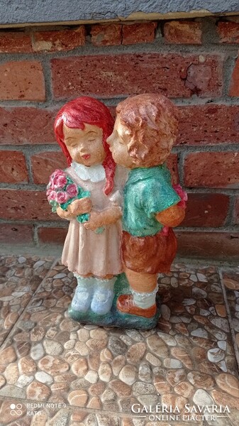 A couple in love, a little girl and a little boy couple, artificial stone statue