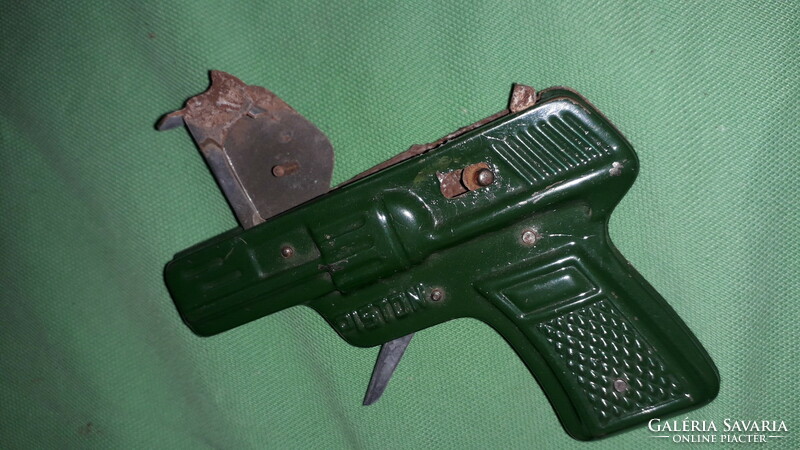 1940s metal plate toy ribbon cartridge pistol, revolver as shown in the pictures