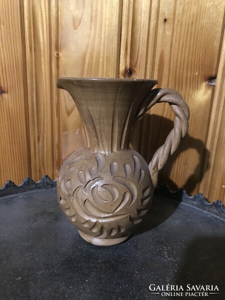 Ceramic jug vase with a folk motif reminiscent of wood carving is very beautiful
