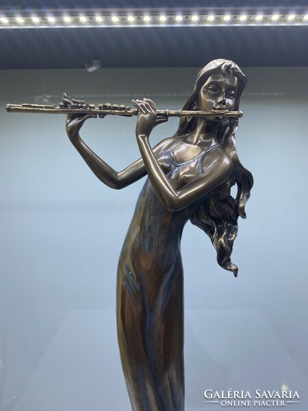 Flute girl bronze statue