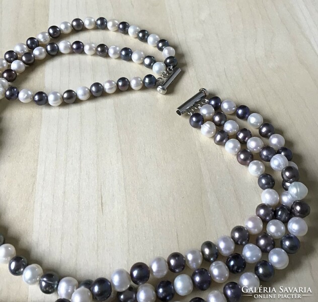 New, three-row cultured two-color string of pearls with a silver clasp