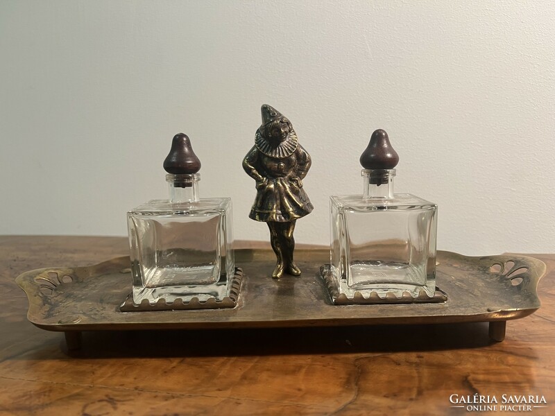 Brass clown girl on tray with glass containers