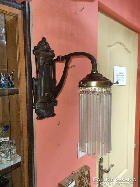 Old renovated Art Nouveau wall arm with glass rod