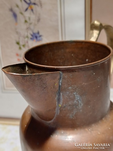 Red copper pitcher with brass spout