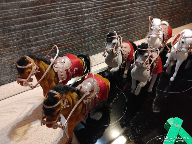 Saddled horses in pairs are children's toys or table decorations