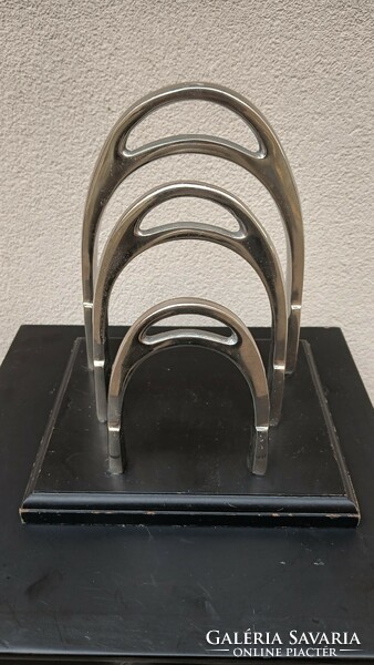 Modern design nickel magazine newspaper holder horseshoe shape.