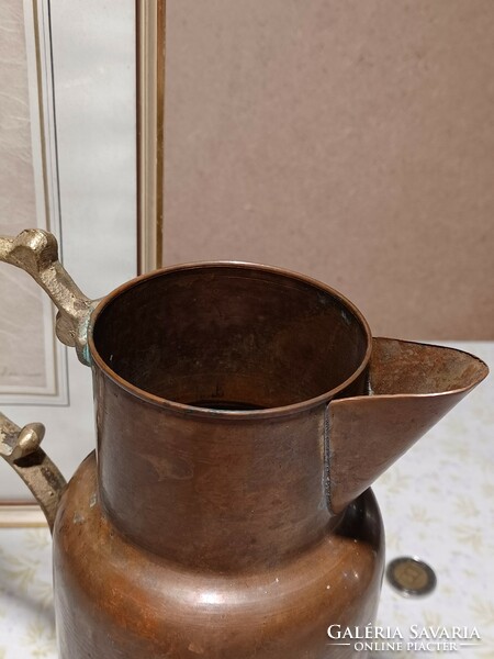 Red copper pitcher with brass spout