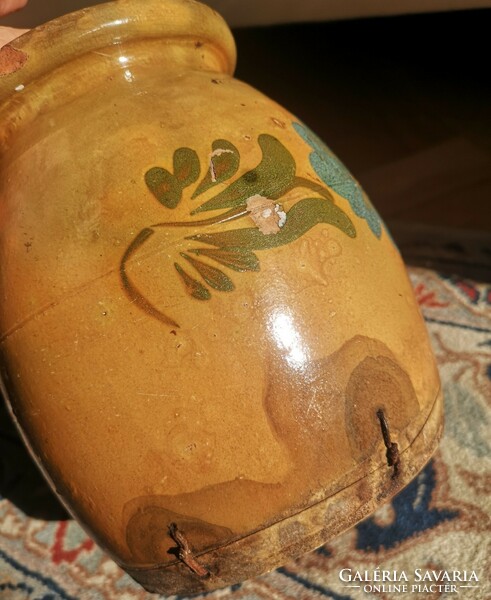 Glazed silk with blue flowers, old, damaged clay bowl