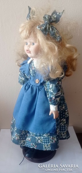 Porcelain doll, marked, with stand, 40 cm