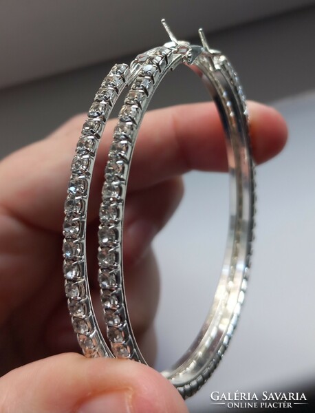 Silver-plated rhinestone hoop earrings.
