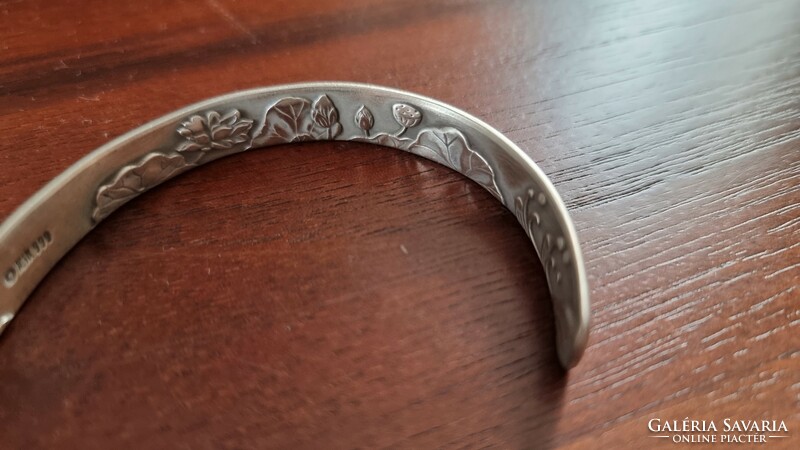 New, never worn handmade 999 silver bracelet with lotus pattern on the outside and inside