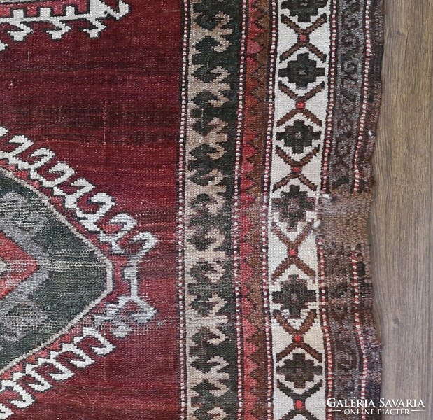 Hand-knotted old wool rug with Caucasian pattern. From an apartment!