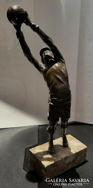 Bronze football statue