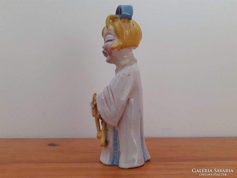 Zilzer dawn: little girl with a musical instrument