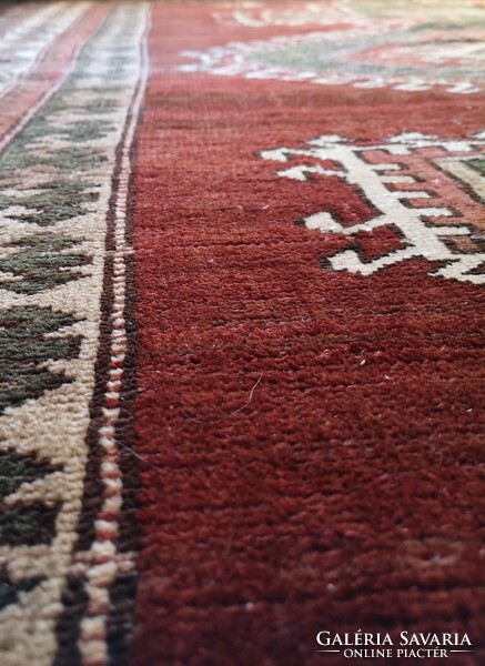 Hand-knotted old wool rug with Caucasian pattern. From an apartment!