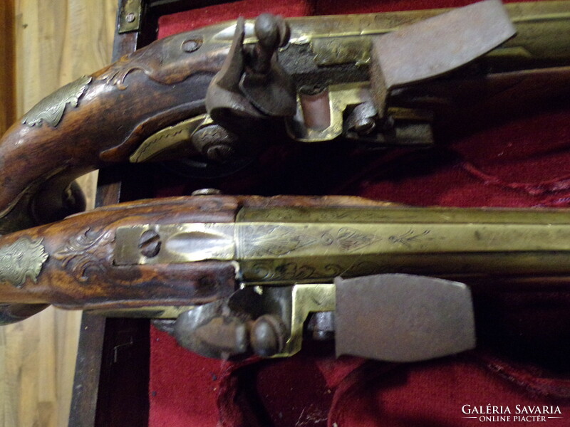 Pair of baroque French flintlock pistols, in box
