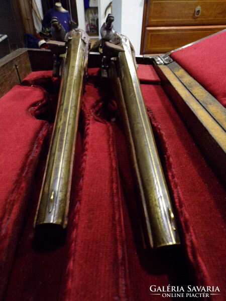Pair of baroque French flintlock pistols, in box