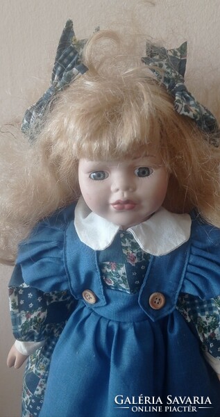 Porcelain doll, marked, with stand, 40 cm