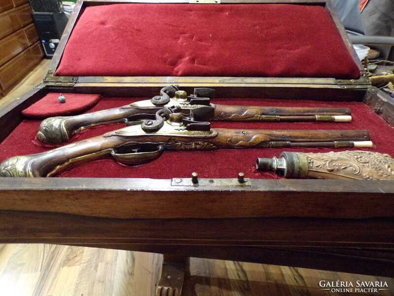 Pair of baroque French flintlock pistols, in box