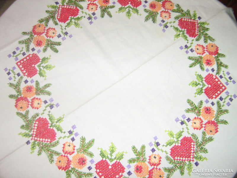A richly hand-embroidered tablecloth with beautiful Christmas motifs
