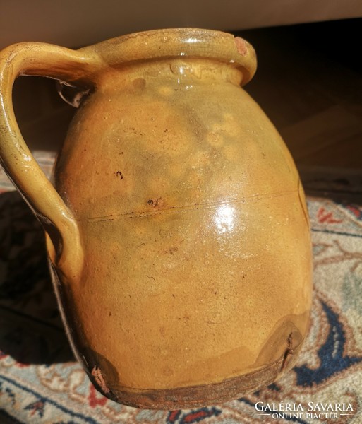 Glazed silk with blue flowers, old, damaged clay bowl