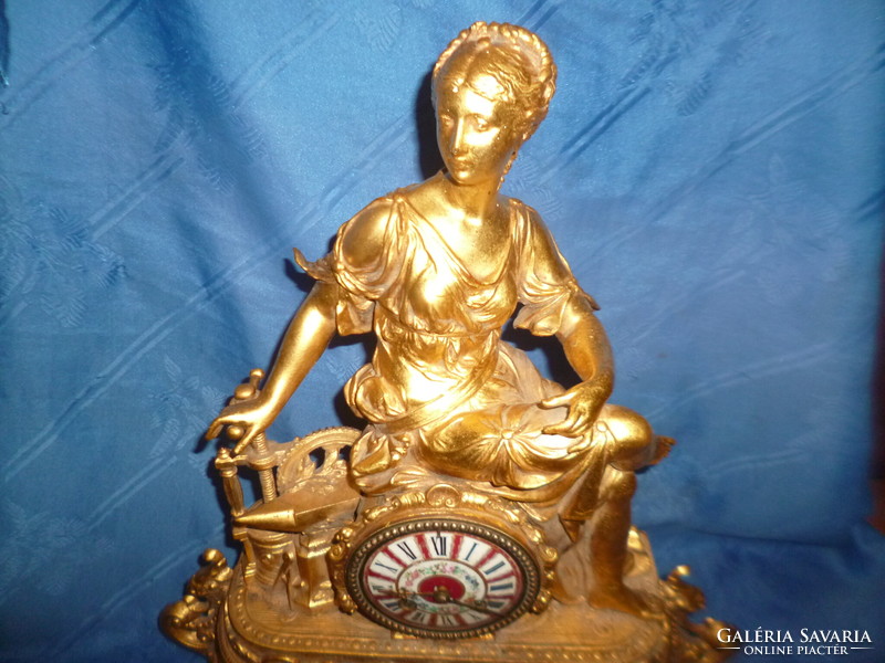 Antique half-baked metal mantel clock with decorative porcelain dial